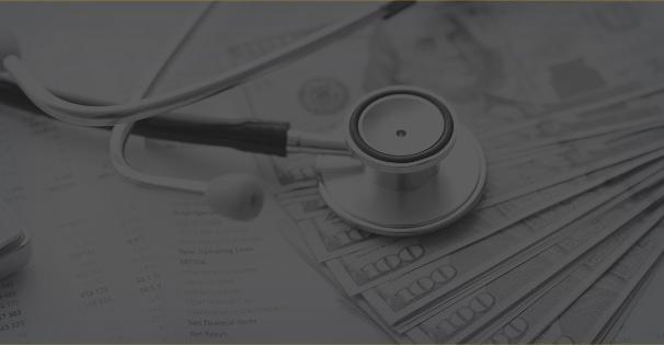 A grayscale image of a stethoscope lying on top of financial documents and currency notes, symbolizing the intersection of healthcare and probate.